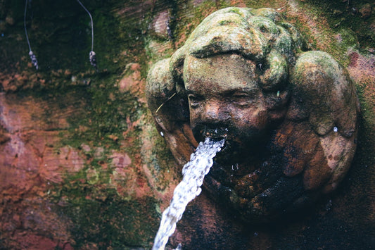 water splash on brown rock