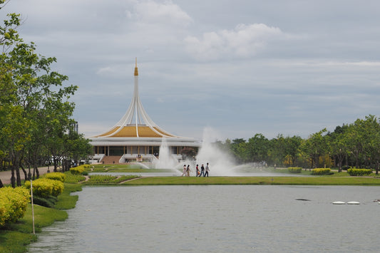 A pond with a fountain in the middle of it